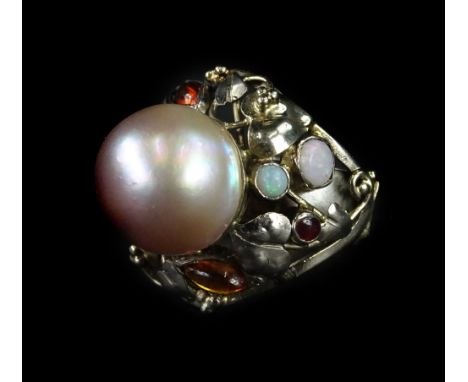 A pearl and gemstone set Arts &amp; Crafts style ring, with foliate twist design, set with citrines, rubellite, and opal, wit