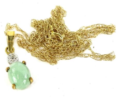 A 9ct gold jade and diamond necklace, the pendant set with oval jade in claw settings, with illusion set tiny diamond to top,
