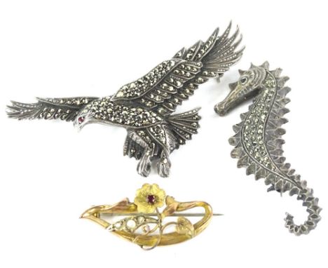 Three brooches, to include a silver and marquasite set eagle brooch, 7cm wide, a silver and marquasite set sea horse, 5.5cm h