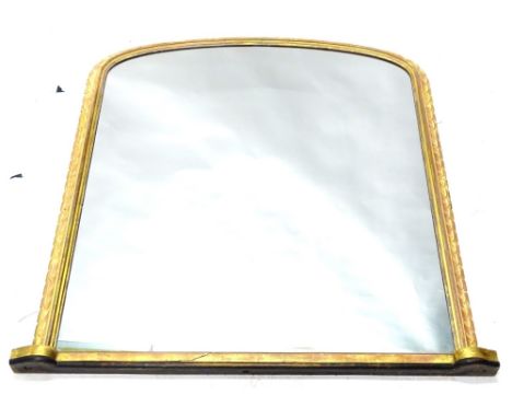 A Victorian gilt over mantel mirror, with arched plate, the frame with a gadrooned border, 132cm H, 121cm W.
