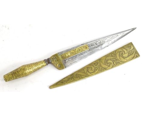 A Spanish or Mediterranean punal dagger, the double fullered blade decorated with scrolls etc., embellished in brass, with ta