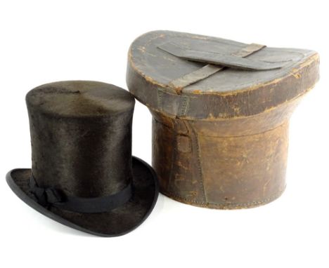 A Gentleman's top hat, stamped A W Wilkinson of Lincoln, in a leather case. (AF)
