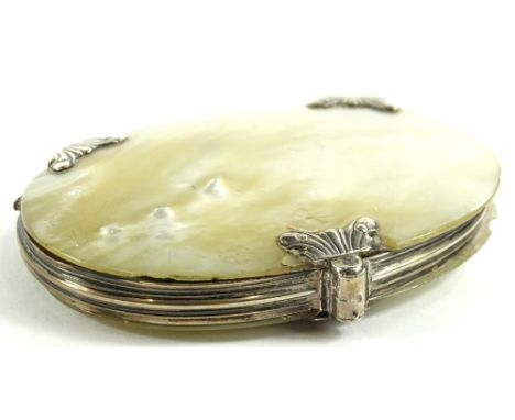A 19thC mother of pearl cased magnifying glass, of oval form with white metal scroll mounts, unmarked, 9cm W.Provenance: The 
