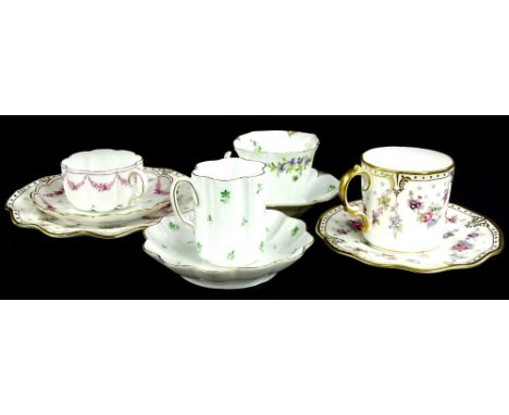 A collection of porcelain, to include a Royal Crown Derby Royal Antoinette pattern trio, Hutschenreuther cabinet cups and sau