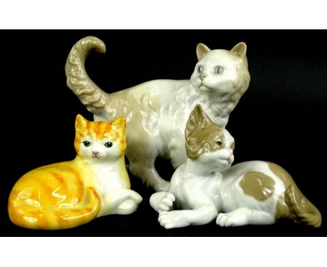 Three porcelain cats, to include Just Cats ginger tom, Nao cat and a Lladro cat (3).