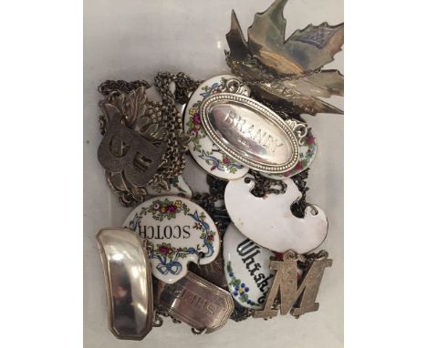 A collection of decanter labels to inc HM silver examples