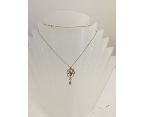 An Edwardian-style amethyst and seedpearl pendant on a 9ct chain
