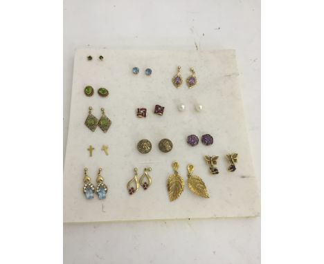 A large quantity of earrings: diamond, ruby, sapphire etc