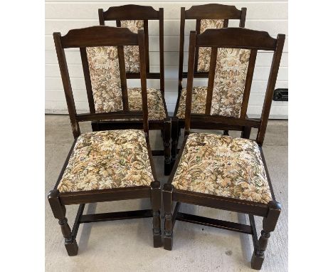 A set of 4 modern 'New Plan Furniture' dark wood dining chairs. Tapestry upholstered seats and backs with castle and floral d
