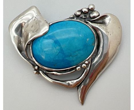 An Art Nouveau style 950 silver brooch set with a large turquoise colour ceramic panel. Approx. 5.5cm  x 4.5cm. 