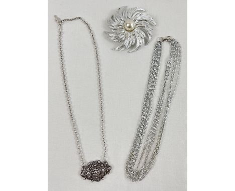 3 items of vintage costume jewellery by Sarah Coventry. A large silver tone floral style brooch set with a faux pearl, a sing