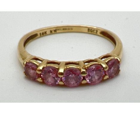 A 14ct gold half eternity ring set with 5 round cut pale pink Diamonique cubic zirconia stones. Size MÂ½, total weight approx