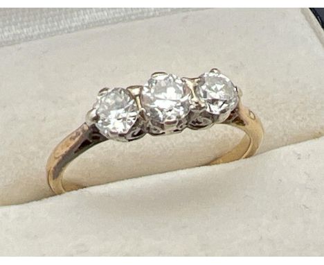 A vintage 18ct gold .60ct diamond trilogy ring. Worn marks to inside of band but tests as 18ct. Ring size K, total weight app