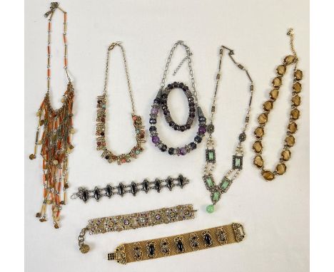 A collection of vintage stone, glass and natural stone set costume jewellery necklaces and bracelets. In varying colours and 