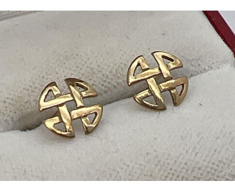 A pair of unmarked 9ct yellow gold stud earrings in the shape of Celtic knots. One butterfly back missing. Total weight appro