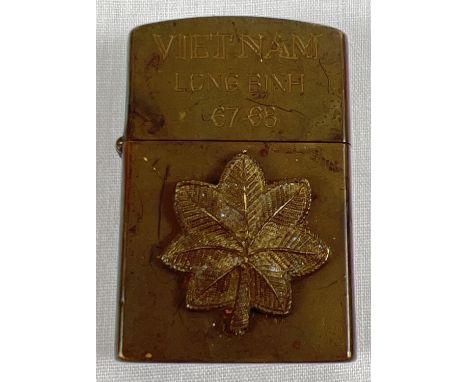 A Vietnam War era Zippo lighter, case dated 1965, engraved Long Binh 1967-1968. 