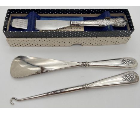 3 vintage silver handled items. A boxed mid century butter knife with Queens pattern embossed handle, hallmarked Sheffield 19