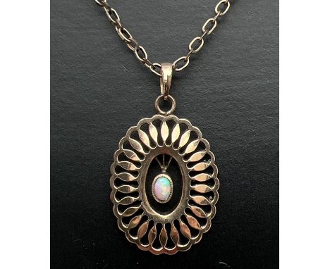 A vintage gold plated pendant set with central oval shaped opal. On a 21" yellow metal belcher style chain. Pendant approx. 3