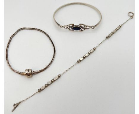 3 silver and white metal bracelets. A decorative silver bead and chain bracelet, a Rhona Sutton charm bracelet and a bangle w