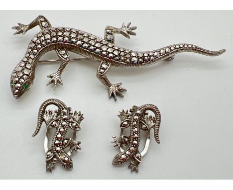 A vintage silver marcasite set lizard brooch with matching clip on earrings. Both marked 835 to reversese, brooch approx. 7.5