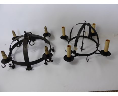 A Wrought Iron Four Branch Spherical Ceiling Light, approx 64 x 64 cms together with another wrought iron spherical ceiling l