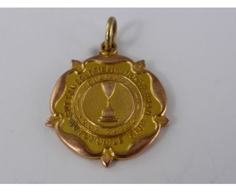 A 9ct Gold Presentation Medallion, the medallion reads "Sutton Coldfield and North Birmningham Automobile Club Colmore Cup Tr