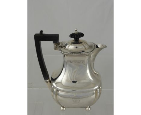 A Solid Silver Coffee Pot, on ball feet with ebony handle and finial, Birmingham hallmark, dated 1927/8, approx 350 gms
