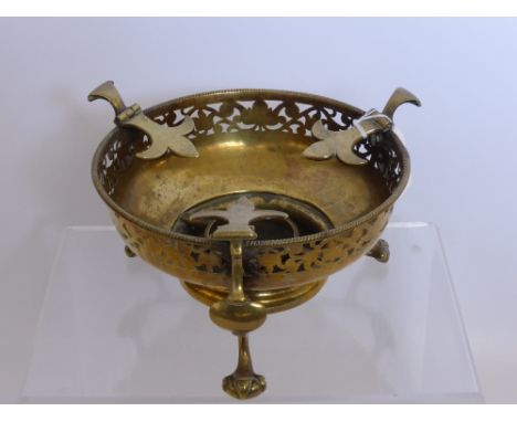 Brass Antique Candle Stand, of decorative floral design with "Fleur de Lys" supports, on tripod base with ball and claw feet.