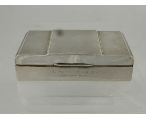 A Silver Double Cigarette Box, the Art Deco box having an engine turned top, cedar lined and engraved A.N.D.& S.D 7th July 19