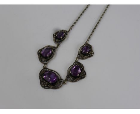 A Vintage Sterling Silver Amethyst Style Drop Pendant, approx 22 cms length of drop. The necklace set with five amethysts, ce