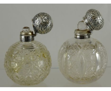 Two Cut Glass Silver Topped Perfume Bottles, both with the original stoppers, the first bottle Birmingham hallmark, m.m R P d
