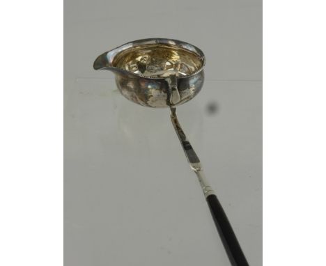 A Georgian Brandy Ladle, having twisted stem, inset with 1758 silver six pence to bowl, waf.