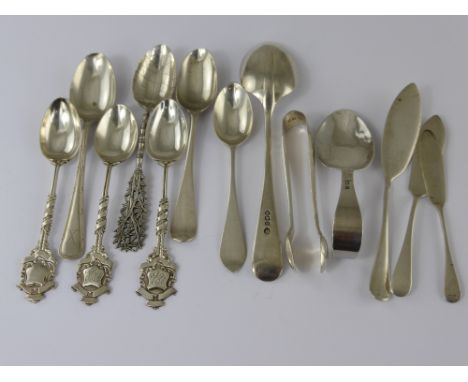 Twelve Miscellaneous Silver Spoons, including three presentation teaspoons, caddy spoon, three butter knives,sugar nips, Chin