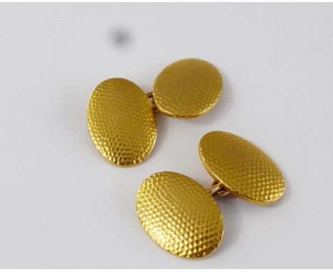 A Pair of Gentleman's Cufflink's, 10 k hallmark, mm WJH, the oval cufflink's having a stippled design, approx 9.5 gms