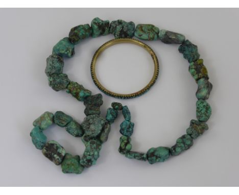 An Unpolished Graduated Turquoise Necklace, together with a turquoise bangle. (2)
