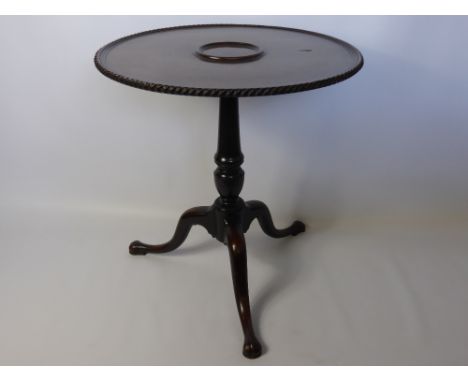 18th Century Carved Mahogany Tripod Table, on turned column support, with central decanter insert.