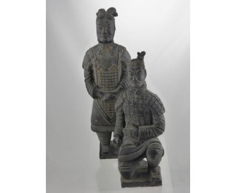 Two Pottery Figures of the Terracotta Army, approx 38 and 30 cms high together with a hard stone Dog of Fo seal. (3)