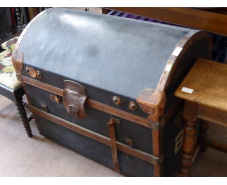 A Vintage Steamer Trunk with leather handles and fittings.