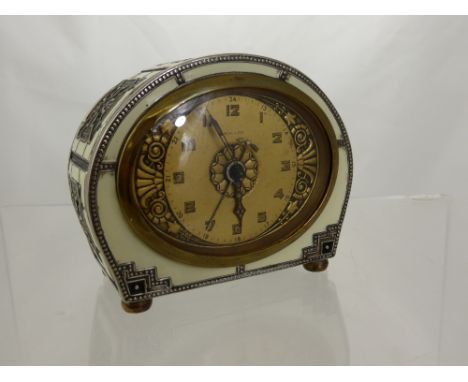 A Haller Brass and Enamel Chime/Alarm Clock. 