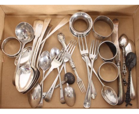 A collection of various Georgian and Victorian silver tea and dessert spoons, condiment spoons, a sauce ladle, various small 