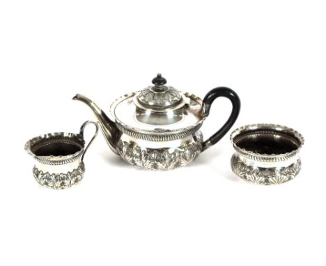 A Victorian silver bachelor's tea set, of baluster form having leaf decoration, the teapot with blackwood handle and lift, Lo