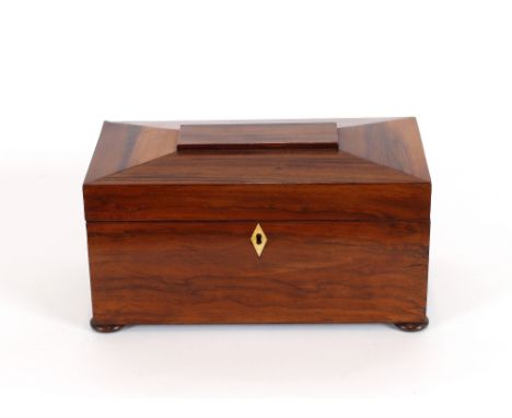 A 19th Century walnut sarcophagus shaped two compartment tea caddy, having central mixing bowl with ivory escutcheon, raised 