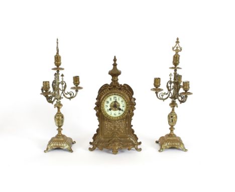 A 19th Century French gilded brass clock garniture, with four light candelabra, the clock having circular white enamel dial a