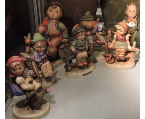 A collection of seven assorted Hummel pottery figures, includes two pairs