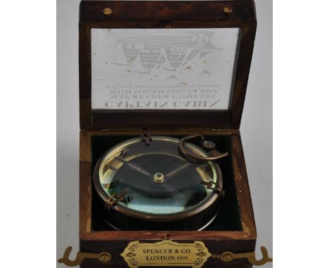 A wooden cased brass compass, in the style of Spencer