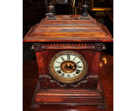 An early 20th Century French oak cased mantle clock