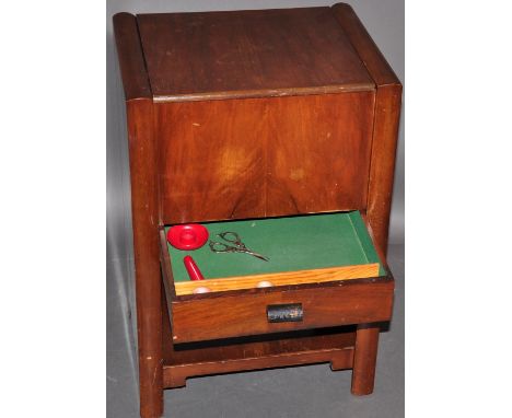 A 1940's workbox by Chard, with hinged top over single drawer, and lower shelf. H: 60cm