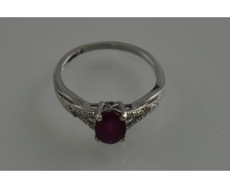 A 9ct white gold, ruby and diamond ring