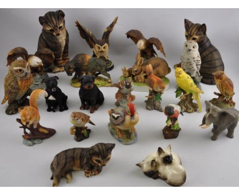 A quantity of ceramic and resing composite animal figures, to include a Beswick kitten group, three further cats, six Maruri 