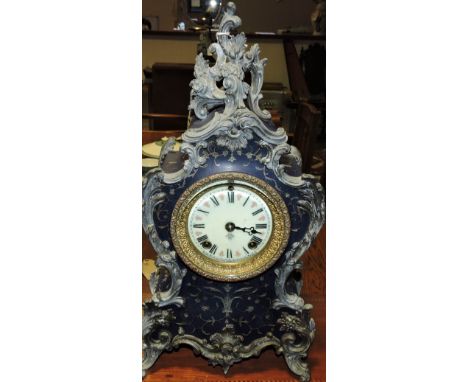 A late 19th/ early 20th century French spelter mounted mantel clock with blue painted case, H. 40cm